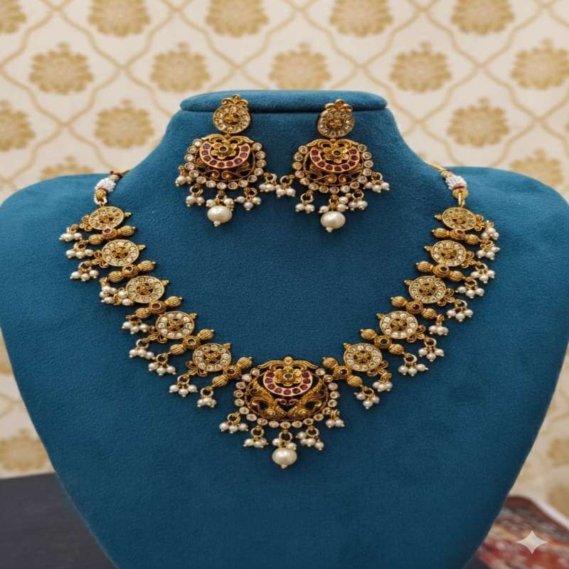 Gold-plated South Indian necklace with traditional handcrafted design.
